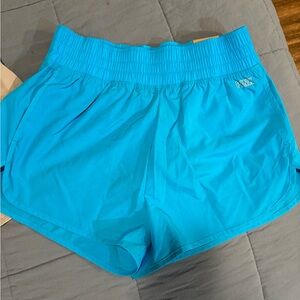 Bright Turquoise Athletic Shorts with Elastic Waistband and Lightweight Fabric